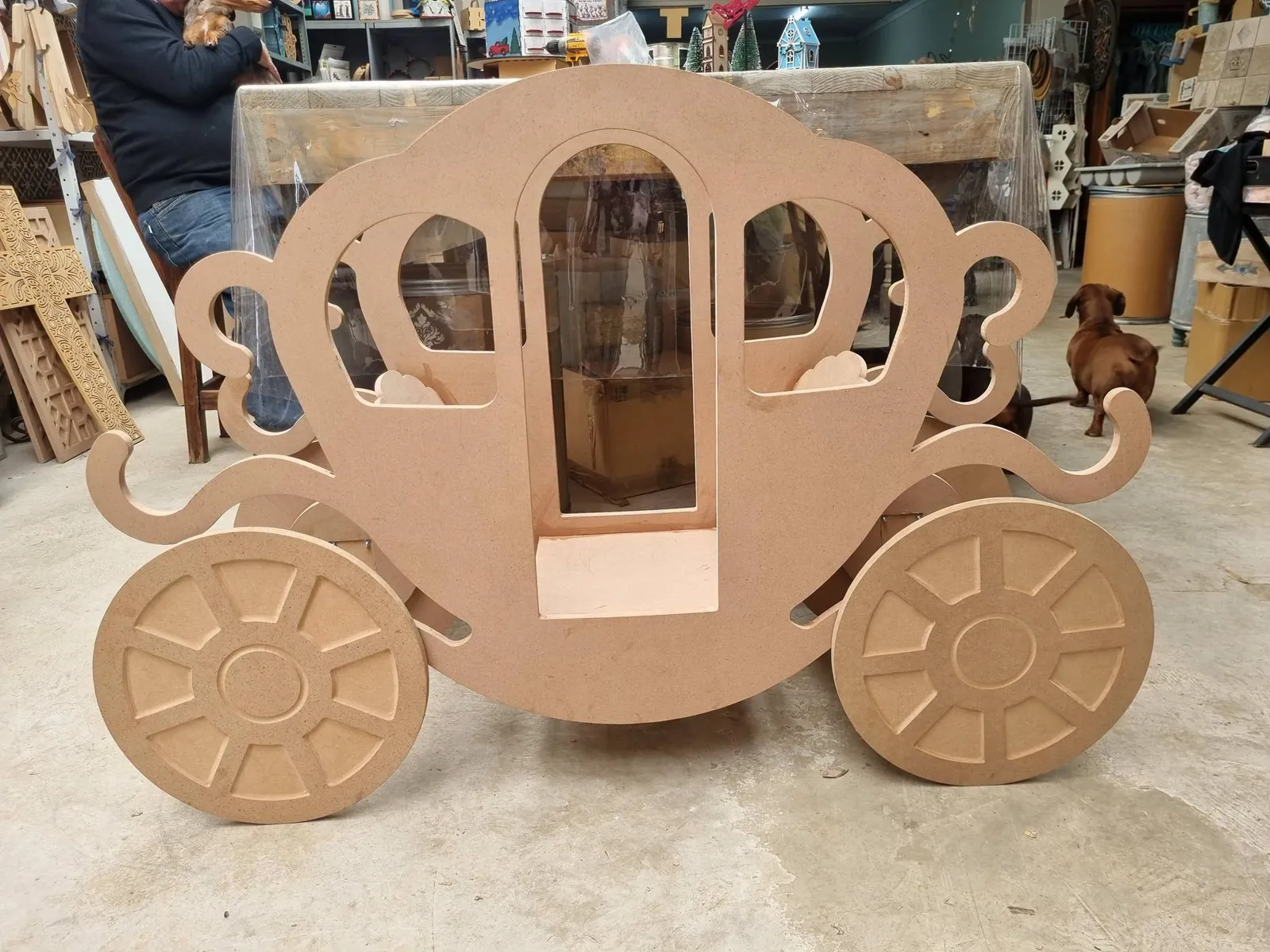 Life-size laser-cut MDF baby chariot in the Tica Studio workshop