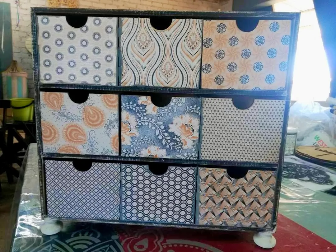 Nine-drawer unit finished in patterned decoupage